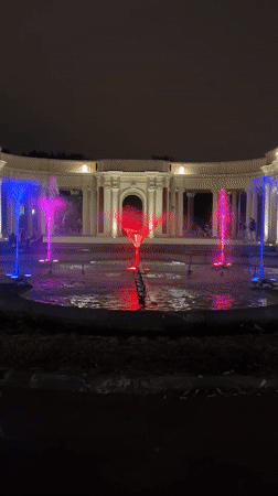 Bilbao fountain lights up the night in front of a neoclassical colonnade