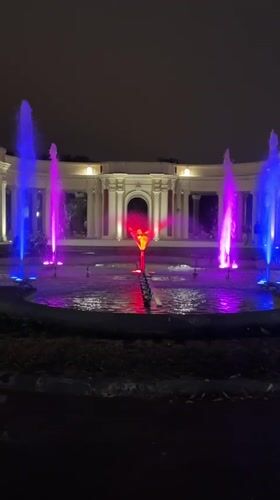 Bilbao fountain lights up the night in front of a neoclassical colonnade