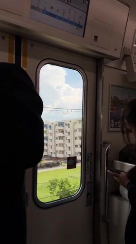 Train passenger films suburban journey through Sakai, Japan