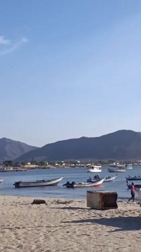 Evening scenes captured in Juan Griego: beach boats, town square