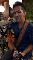 Live acoustic set at a Kuta Selatan outdoor venue at night