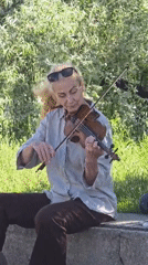 Everyday Warsaw moments: street musician, pigeons, architecture, tram, flags