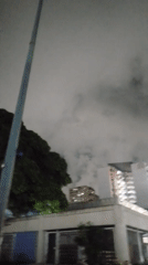 Late-night street life across a Caracas neighborhood
