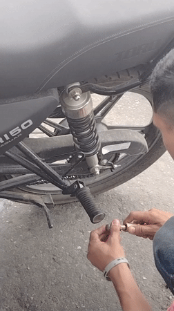 Evening life documented in Tinaquillo: motorcycle repair, cooking, flora