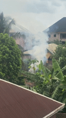 Smoke billows from residential buildings in Umuode, Nigeria