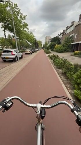 Bike ride along red cycling path in Rijswijk