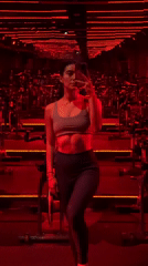 Woman takes mirror selfies at Puebla fitness studio