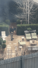 Man walks across decorated patio in New York