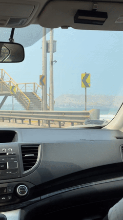 Driver travels coastal road in Miraflores with ocean views