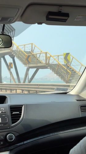 Driver travels coastal road in Miraflores with ocean views