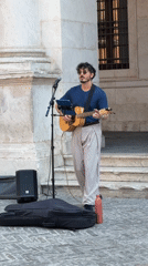 Street musician performs near Basilica di Santa Maria Maggiore, Bergamo