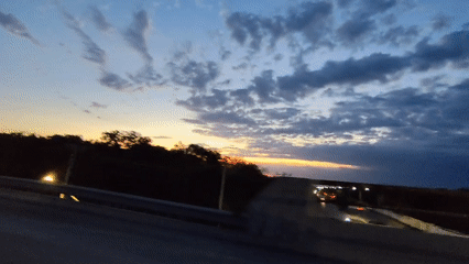 Sunset captured from moving vehicle on Playa del Carmen overpass