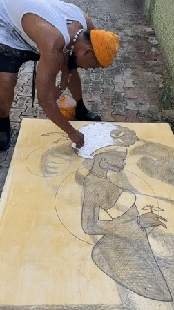 Artist creates large outdoor painting in Ado, Nigeria