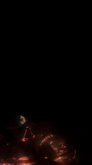 Campfire burns at night in Čelobrdo, Montenegro