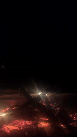 Campfire burns at night in Čelobrdo, Montenegro