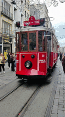 Vintage trams operate through crowded Beyoğlu pedestrian streets