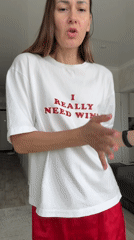 Woman dances, takes selfies in wine-themed shirt in Sochi home