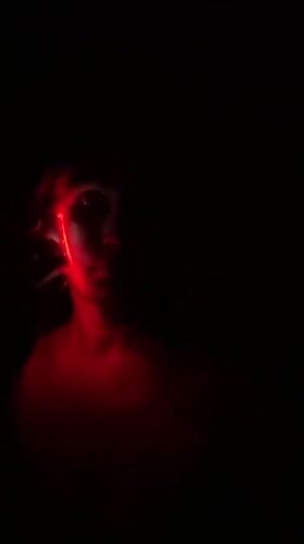 Woman uses blue light therapy device in Fethiye