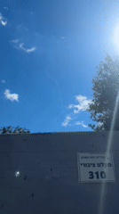 Rocket contrails spotted over Ramat Hasharon as residents gather