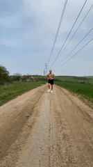 Tattooed jogger spotted running on dirt road in Pleven