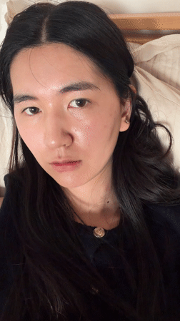 Woman resting indoors captured in Paris afternoon