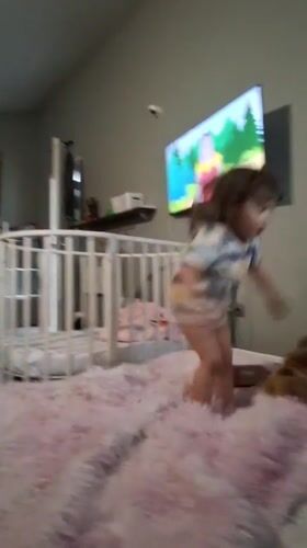 Toddler plays with giant plush duck toys in Russian home