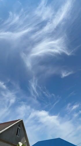 Clear summer skies over Khazar Raion rooftops
