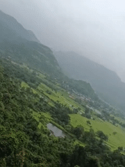 Green valley and farmland viewed from above near Bid Khurd