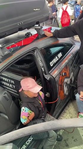 Modified car meet underway in an Irkutsk outdoor lot
