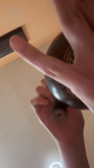 Person operates bronze singing bowl in recorded session