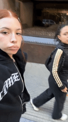 Young woman documents gothic-styled selfies near Buenos Aires basilica