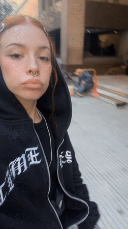 Young woman documents gothic-styled selfies near Buenos Aires basilica