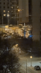 Police cars with flashing lights gather in Moscow apartment area