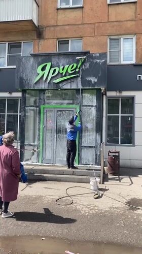 Morning storefront cleaning at Novokuznetsk coffee shop