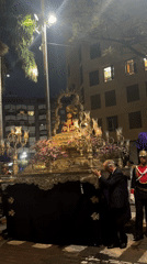 Religious procession with ornate float in Santa Cruz de Tenerife