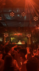 Nightclub event with illuminated cube structure documented in Kuta Selatan