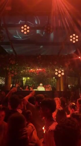 Nightclub event with illuminated cube structure documented in Kuta Selatan