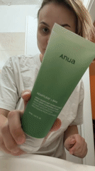 Woman applies skincare routine in Tel Aviv bathroom