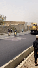 Road paving draws crowds in Kandahar neighborhood