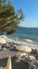 Crowded pebble beach day in Bar, Montenegro