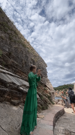 Street musician performs flute in historic Budva Montenegro