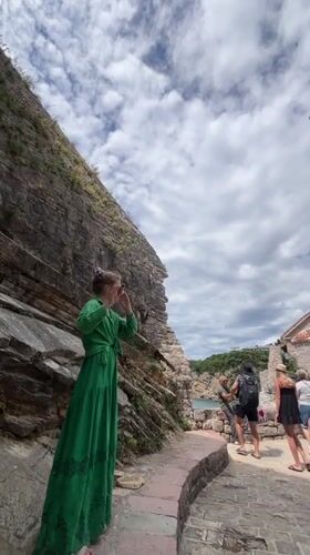 Street musician performs flute in historic Budva Montenegro