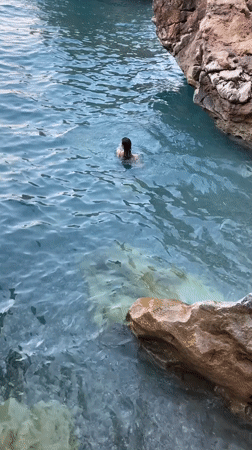 Rocky Mediterranean shoreline in Kemer on a calm summer afternoon