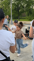 Young girls dance for crowd in Moscow park