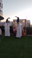 Outdoor festival evening in Astana with stilt performers and market stalls