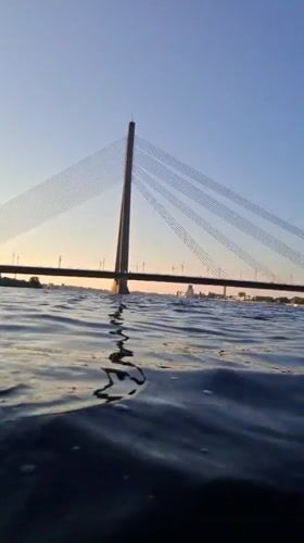 Bridge views and street-level portraits in Riga