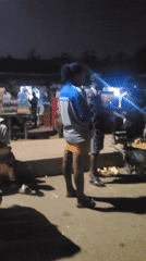 Nigerian gas station bustling with vendors and customers