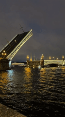 Saint Petersburg drawbridge opens at night on the Neva