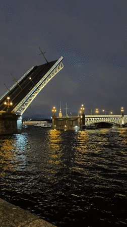Saint Petersburg drawbridge opens at night on the Neva