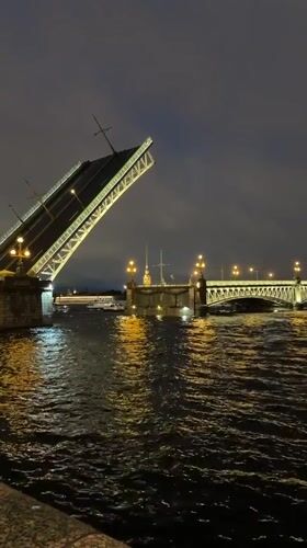 Saint Petersburg drawbridge opens at night on the Neva